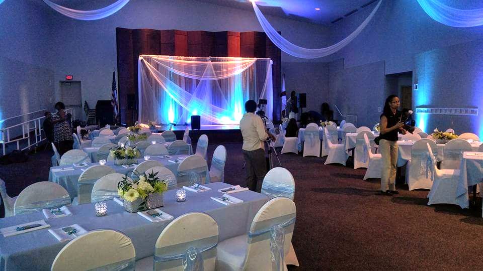 Banquet tables set before the gathering